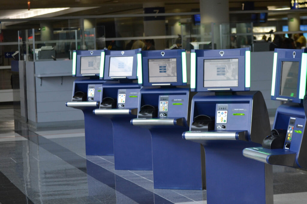 A row of self service kiosk screens